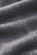 Close-up top-down view of the Gran Sasso Cashmere half-zip jumper dark grey melange showing fine knit pure cashmere fabric with soft touch and elastic rib cuffs.