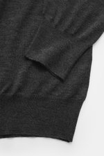 Gran Sasso Fine knit polo dark grey shown from a close-up top-down view highlighting the fine knit texture and ribbed cuffs. The lightweight knit polo by GRAN SASSO is made from ultra-fine virgin wool, cashmere, and silk. A timeless essential that adds a 