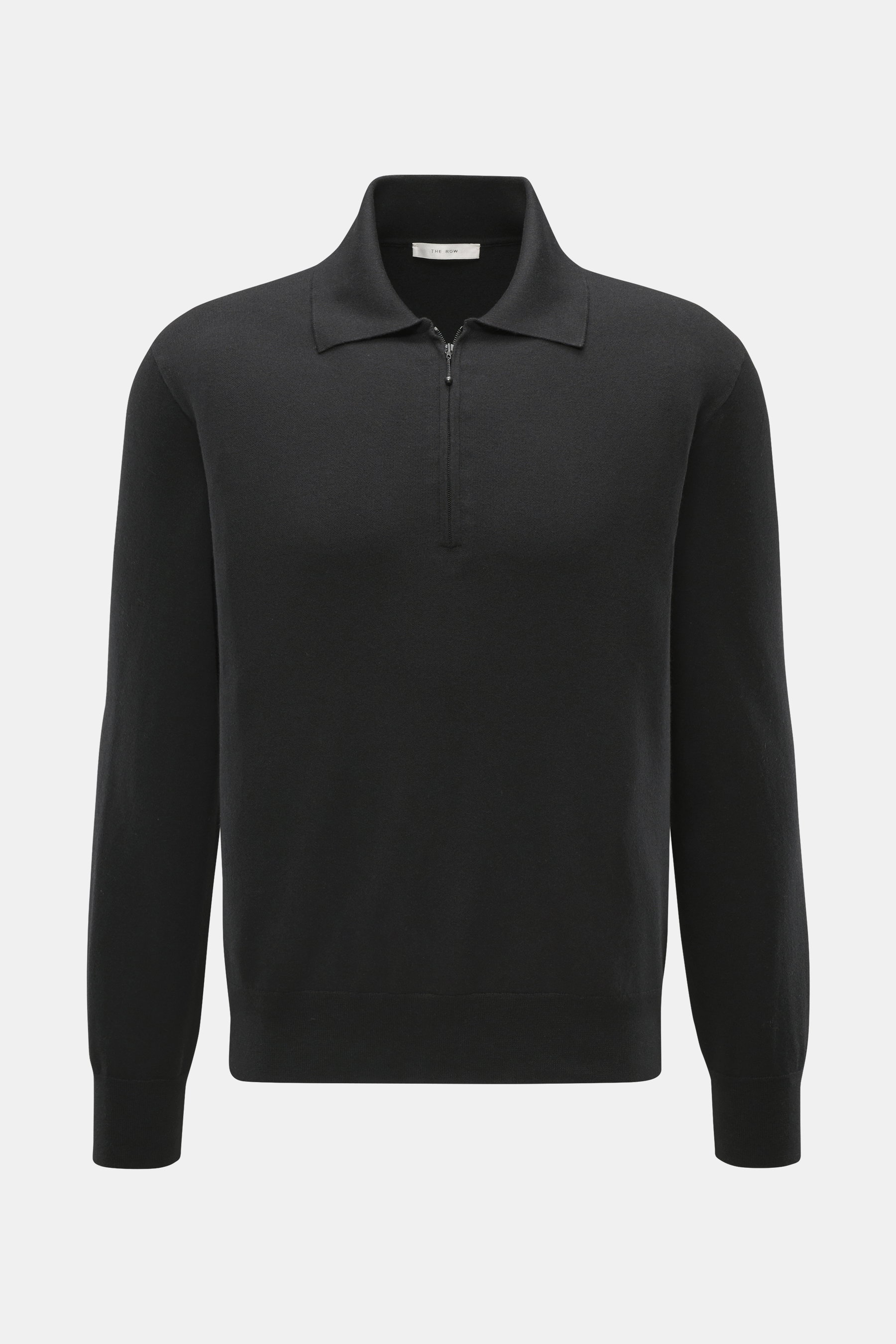 Front view of The Row Knit polo 'Miranne' black, showing a slim fit, fine knit pattern, polo collar with zipper, ribbed cuffs, made from a soft cashmere and cotton blend.