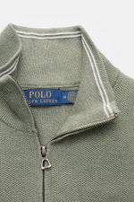 Close-up front perspective of Polo Ralph Lauren Half-zip jumper mint green with half-zip collar and textured knit.

<p>A essential for mild days: This half-zip jumper by POLO RALPH LAUREN is made of high-quality cotton material and is a stylish piece for 