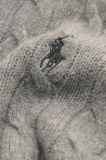 Close-up top-down view of the Polo Ralph Lauren Troyer gray showing detailed cable knit texture and tonal polo player stitching.

Description: <p>An essential for cool days: This Troyer by POLO RALPH LAUREN impresses with high-quality cable knit made of w