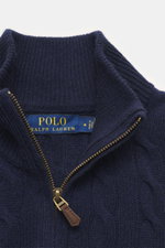 Close-up front view of Polo Ralph Lauren Troyer navy showcasing the high-quality cable knit wool with cashmere, slim fit, Troyer collar with zipper, and ribbed cuffs. An essential for cool days: This Troyer by POLO RALPH LAUREN impresses with high-quality