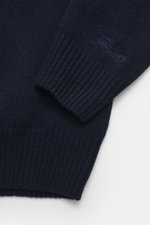 Close-up front view of the MC2 Saint Barth Quarter-zip jumper 'Buck' navy sleeve showing medium coarse knit, pure wool, soft feel, ski motif patches, regular fit, stand-up collar with zipper, and ribbed cuffs.