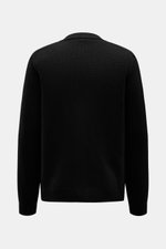 Rückansicht des 04651/ A trip in a bag Cardigan 'Bold' schwarz aus reiner Lammwolle mit grobem Strickbild, Oversized Fit und weichem Griff.