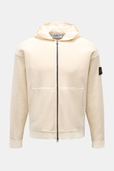 Front view of Stone Island Sweatjacke creme, a sportive zip-up hoodie with hood, kangaroo pocket, ribbed cuffs, and compass badge on sleeve.

Description: <p>Strick mit Twist: Die sportive Jacke mit Kapuze im modernen Linksstrick von STONE ISLAND wird zum