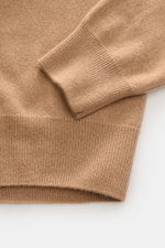 Close-up view of the Fioroni Cashmere cardigan light brown mottled, showcasing exquisite craftsmanship from Italy in fine baby cashmere with pure cashmere, very soft feel, fine knit, slim fit, smooth button placket, and flexible ribbed bands.