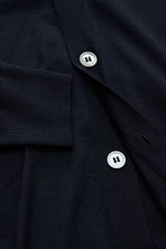 Close-up front view of the BRAUN Hamburg Cardigan navy showing fine knit fabric, silver buttons, and ribbed cuff details.

<p>Luxury you can feel on your skin, in a timeless and elegant design: This fine knit cardigan by BRAUN HAMBURG is defined by a fine