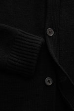 Close-up front view of the von Braun Cashmere cardigan black showing soft, medium-fine knit, ribbed cuffs, button placket, and slanted pockets.

<p>Maximum comfort with the highest standards: This cardigan from the VON BRAUN Cashmere collection is made of
