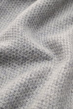 Close-up top-down view of von Braun Cashmere cardigan grey mottled showing fine textured, medium-fine knit of pure Mongolian cashmere fabric.

Description: <p>Maximum comfort with the highest standards: This cardigan in a textured knit from VON BRAUN’s ca