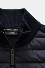 Close-up front view of the Canada Goose Cardigan 'Hybridge Knit' navy, featuring a pure wool knit collar and down-lined quilted microfiber front zipper.

Description: <p>Make a smooth transition into the new season with the cardigan 'Hybridge Knit' from t