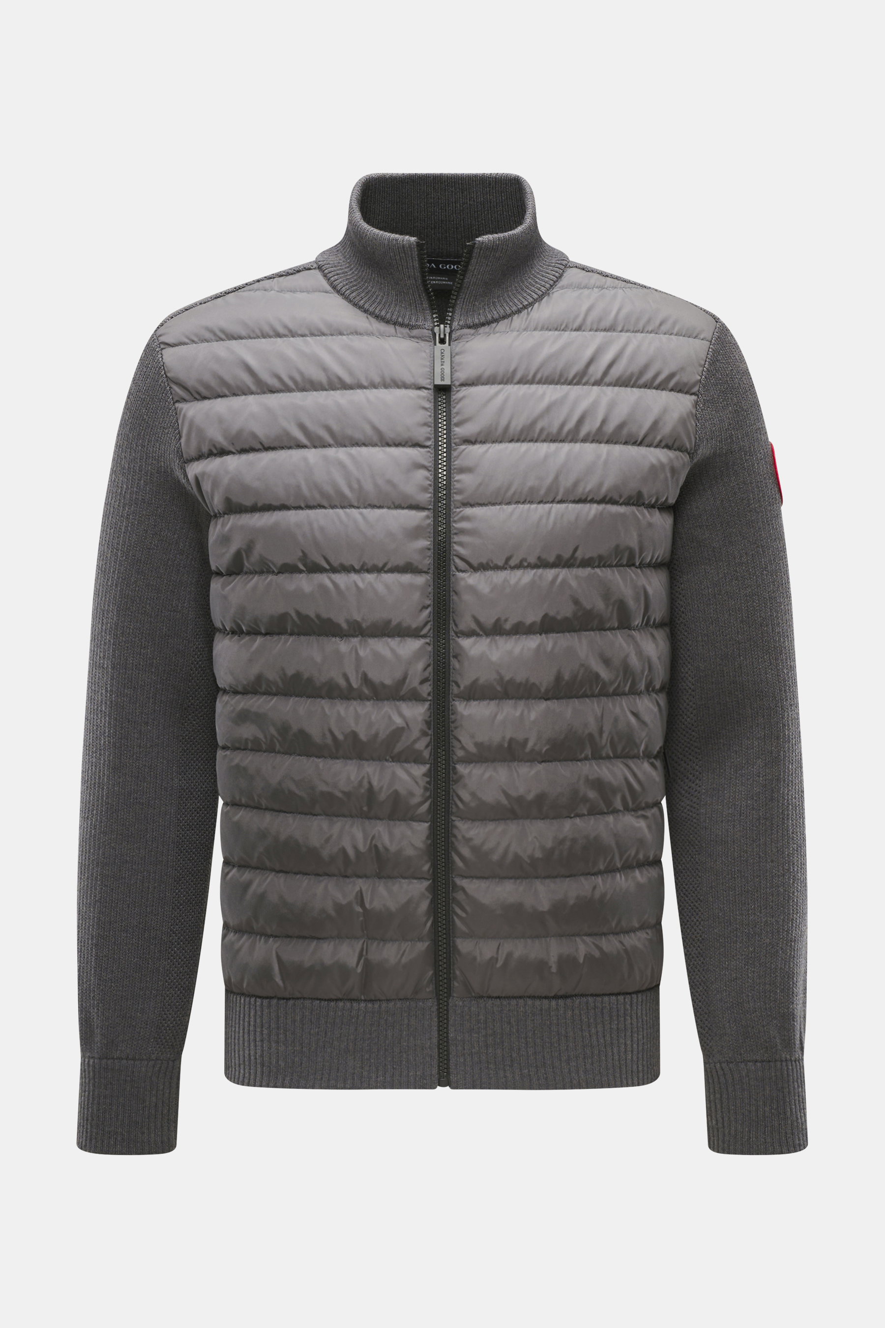 Vorderansicht des Canada Goose Daunen-Strickblouson 'Hybridge Knit' dunkelgrau mit Daunen-Front, Wollstrickärmeln, Stehkragen und Reißverschluss.