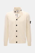 Stone Island Cardigan 'Lambswool' cream shown from front, featuring wool blend knitwear, standing collar with embossed buttons, zip, felt details, slim fit, and compass badge on upper sleeve.