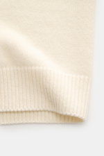 Close-up front view of the Stone Island Cardigan 'Lambswool' cream, showing soft wool blend knitwear with ribbed elasticated bands. A stylish essential for cool days: this casual cardigan by STONE ISLAND in a warm wool blend features distinctive purl-knit