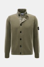Stone Island Cardigan 'Lambswool' olive shown from the front, featuring a slim fit, standing collar with buttoned tab, two-way zip, felt details, embossed buttons, contrasting knit stripes, elasticated ribbed bands, and the iconic compass badge on the upp