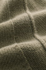Close-up front view of the Stone Island Cardigan 'Lambswool' olive showing its warm wool blend, distinctive purl-knit sections, and soft texture. A stylish essential for cool days: this casual cardigan by STONE ISLAND in a warm wool blend features distinc