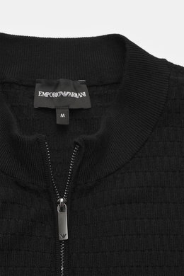 Close-up front view of Emporio Armani Cardigan black showing ribbed stand-up collar, two-way zipper, and fine textured knit pattern in pure virgin wool.