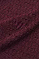 Close-up front angle of Emporio Armani Cardigan burgundy made of pure virgin wool with soft touch, fine textured knit, ribbed collar, cuffs, two-way zipper, and logo stitching on hem.