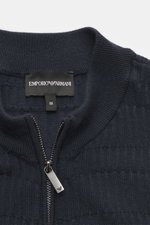 Close-up front view of Emporio Armani Cardigan navy showing ribbed stand-up collar, two-way zipper with logo, and textured fine knit pattern.