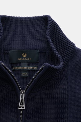 Close-up front view of Belstaff Cardigan 'Commander' navy in pure cotton with slightly textured quality, fine rib stitch pattern, flat knit details, slim fit, concealed metal zipper, ribbed stand-up collar, BELSTAFF woven label on upper arm, and flexible 