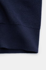 Close-up front view of Belstaff Cardigan 'Commander' navy, showing pure cotton fabric with slightly textured quality, fine rib stitch pattern, flat knit details, slim fit, concealed metal zipper, ribbed stand-up collar, BELSTAFF woven label on upper arm, 
