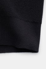 Close-up front view of Belstaff Cardigan 'Commander' black showing pure cotton, slightly textured quality, fine rib stitch pattern, flat knit details, slim fit, concealed metal zipper, ribbed stand-up collar, BELSTAFF woven label on the upper arm, and fle
