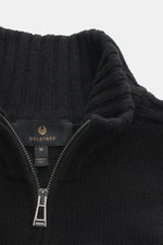Close-up front view of Belstaff Cardigan 'Watch' black showcasing pure wool fabric with a soft touch, coarse knit pattern, rib knit elements, slim fit, stand-up collar, two-way zipper, BELSTAFF woven label on the chest, and flexible ribbed cuffs.