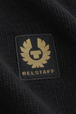 Close-up front view of the Belstaff Cardigan 'Watch' black showing pure wool, soft touch, coarse knit, rib knit elements, slim fit, stand-up collar, two-way zipper, BELSTAFF woven label on the chest, and flexible ribbed cuffs.