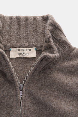 Close-up front view of Fioroni Cashmere cardigan 'Duvet' grey brown melange, showing ribbed stand-up collar, two-way zipper, and fine knit pattern, made from pure cashmere with a very soft feel, slim fit, and flexible ribbed cuffs. Luxurious warmth with I