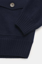 Close-up front-side view of Gran Sasso Cashmere Cardigan navy showing ribbed cuffs, patch pocket with flap, and button detail in fine knit.

Detailed description:
<p>The luxuriously soft cardigan by GRAN SASSO is made from the finest cashmere – a timeless
