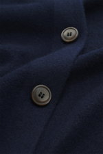 Close-up front view of Gran Sasso Cashmere Cardigan navy showing two buttons on the very soft pure cashmere fabric.

<p>The luxuriously soft cardigan by GRAN SASSO is made from the finest cashmere – a timeless essential that adds a stylish touch to any ca