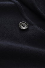 Close-up front view of the Lardini Knitted Blazer Navy showing fine knit pattern and dark button on pure wool fabric.

Description: 
<p>With a classic silhouette and made from pure wool, the knitted blazer by LARDINI brings style and personality to your s
