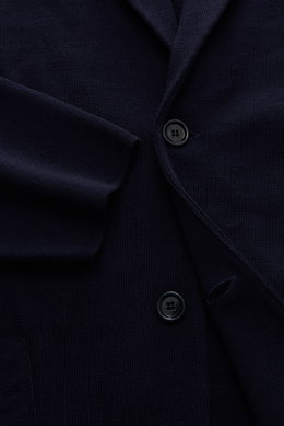 Close-up front view of Lardini Knit blazer navy showing fine knit pattern, two buttons, lapel with flower pin, and sleeve cuff.

Description: <p>With a classic silhouette and made from pure wool, the knit blazer by LARDINI brings style and personality to 
