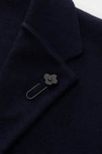 Close-up front view of the Lardini Knit blazer navy collar and lapel, featuring a flower pin on fine pure wool knit fabric.

Description: <p>With a classic silhouette and made from pure wool, the knit blazer by LARDINI brings style and personality to your