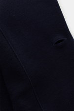 Close-up detail of navy knit from the Lardini Knit blazer navy, showing fine knit pattern and buttonhole from a top-down perspective.

Description: 
<p>With a classic silhouette and made from pure wool, the knit blazer by LARDINI brings style and personal