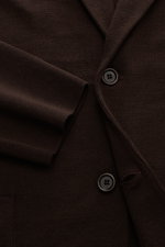 Close-up front view of the Lardini Knit blazer dark brown showing fine knit pattern, two-button style, and sleeve cuff.

Additional description: 
<p>With a classic silhouette and made from pure wool, the knit blazer by LARDINI brings style and personality