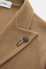 Lardini Knitted blazer light brown close-up from above showing classic wool knit texture, lapel with flower pin, and fine knit pattern.