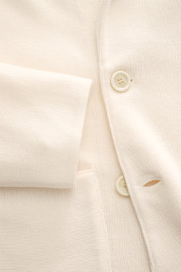 Close-up front view of Lardini Knitted blazer cream showing fine knit pattern, button, and cuff detail in pure wool.

Description: <p>With a classic silhouette and made from pure wool, the stylish knitted blazer by LARDINI perfects your smart casual wardr