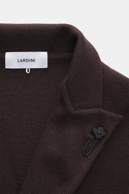 Lardini Knitted blazer dark brown close-up from above showing knit texture, lapel with flower pin, and label.  
With a classic silhouette and made from pure wool, the stylish knitted blazer by LARDINI perfects your smart casual wardrobe.  
- knit from pur