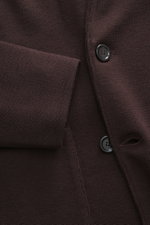 Close-up front view of Lardini Knitted blazer dark brown showing fine knit pattern, buttons, and cuff detail in pure wool.

Description: <p>With a classic silhouette and made from pure wool, the stylish knitted blazer by LARDINI perfects your smart casual