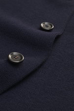 Close-up front perspective of Lardini Cardigan navy showing pure new wool fabric with soft feel, fine knit pattern, slim fit, four-button placket, open collar, patch chest and hip pockets.