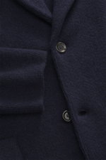 Close-up front view of Lardini Cashmere knit blazer 7310.072338-210 in navy, showing fine knit texture, buttons, and lapel detail.

Description: <p>Exquisite knit blazer from LARDINI: This model in smooth, fine pure cashmere knit adds warmth and style to 