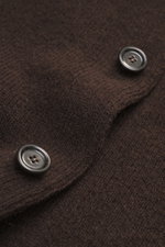 Close-up angled view of the Lardini Cardigan dark brown showing pure virgin wool fabric with a soft feel, heavy quality, medium fine knit pattern, four-button placket, stand-up collar, patch hip pockets, and regular fit.