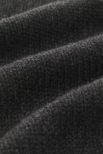 Close-up front view of The Row Cashmere Cardigan 'Manor' dark grey melange showing coarse knit pattern, soft touch, and ribbed texture.