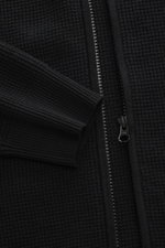 Nahaufnahme der schwarzen C.P. Company Strickjacke 'Metropolis' mit robustem Reißverschluss, Rippbündchen, Kapuze, Taschenlogo, Regular Fit, Schurwolle-Microfaser-Mix.