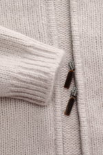 Close-up front view of Iris von Arnim Cashmere-silk cardigan 'Felias' sand, showing slim fit with voluminous knit pattern, ribbed stand-up collar, comfortable ribbed cuffs, and two-way zipper, made from a mix of cashmere and silk with a very soft feel.
