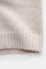 Close-up front view of Iris von Arnim Cashmere-silk cardigan 'Felias' sand, showing voluminous knit pattern, ribbed stand-up collar, and comfortable ribbed cuffs, made from a mix of cashmere and silk with a very soft feel, slim fit, and two-way zipper.