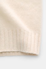 Filippo de Laurentiis Cardigan creme, Detailaufnahme von unten, Mix aus Cashmere, Seide, Microfaser, weicher Griff, mittelfeines Strickbild, Oversized Fit, Umlegekragen, Rippbündchen.