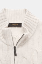 Close-up front view of Moorer Cashmere-silk cardigan 'Dean' off-white, featuring a mix of cashmere and silk, very soft feel, medium fine knit pattern, classic cable knit design, slim fit, two-way zipper, ribbed stand-up collar, and flexible ribbed cuffs.