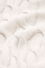 Close-up front view of the Moorer Cashmere-silk cardigan 'Dean' off-white, showing medium fine knit pattern, classic cable knit design, mix of cashmere and silk, very soft feel, slim fit, two-way zipper, ribbed stand-up collar, and flexible ribbed cuffs.