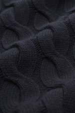 Close-up, slightly angled view of the navy Moorer Cashmere-silk cardigan 'Dean' showing its very soft feel, medium fine knit pattern, classic cable knit design, slim fit, two-way zipper, ribbed stand-up collar, and flexible ribbed cuffs in a mix of cashme
